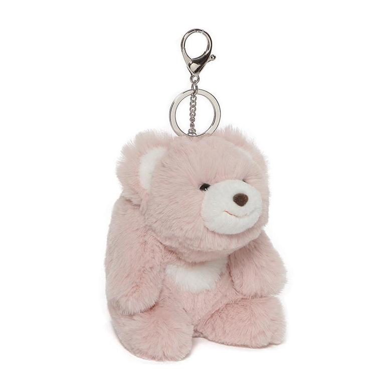 Small pink plush with white ears, snout and abdomen. Silver lobster claw keychain attached to it's head.