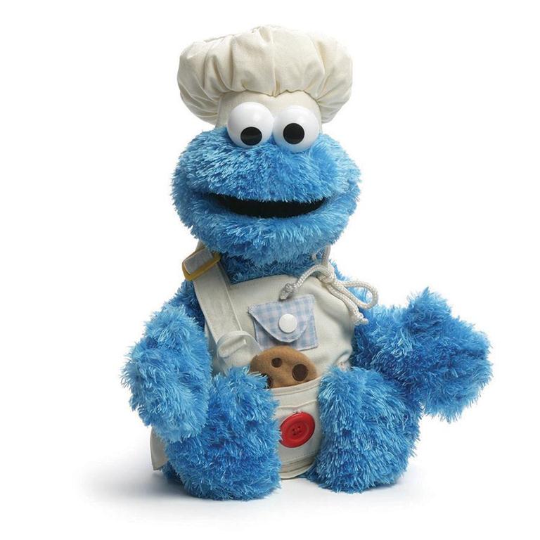 Blue Cookie Monster in a chef's outfit.